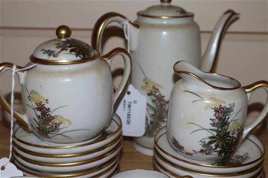 A Japanese Satsuma part coffee service, decorated with flowers and heightened in gilt, comprising coffee pot, cream jug,